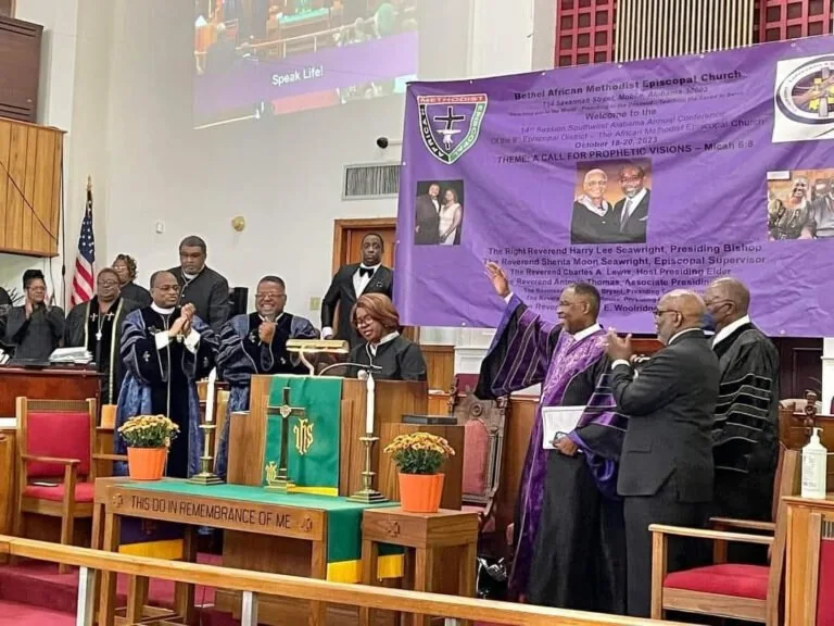 Dr. Lewis preaching at an AME gathering